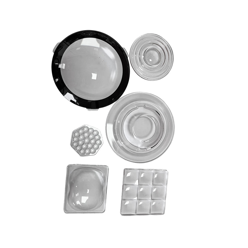 How do street light lenses achieve more uniform road illumination?